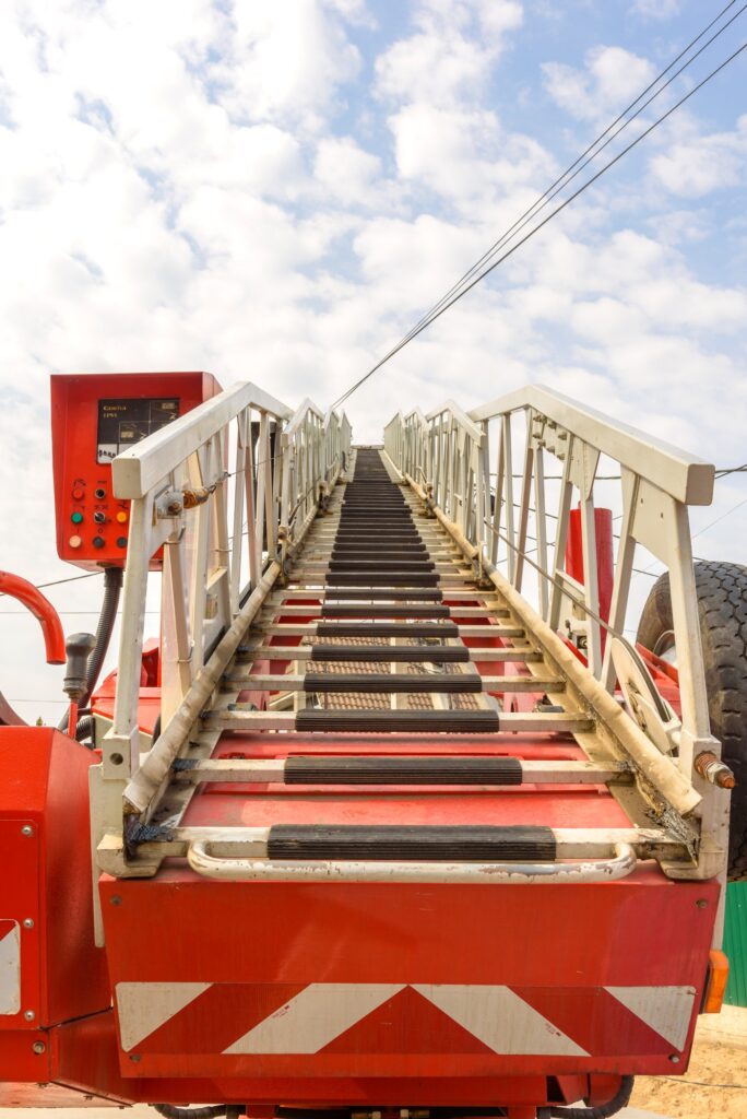 Hydraulic equipment of lifting crane with boom and basket for workers